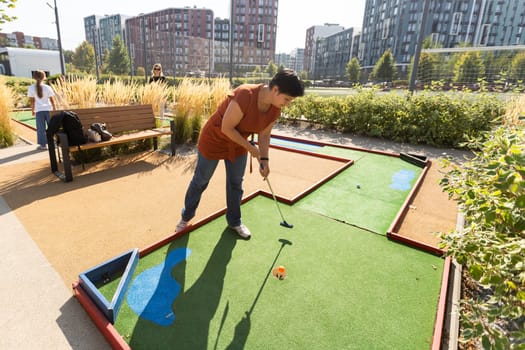 Minigolf player detail on green grass. High quality photo