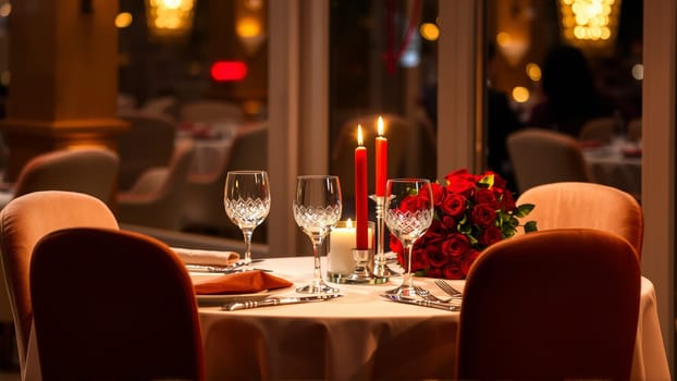 A table in the restaurant is served for the holiday. Candles are burning on the table. High quality photo