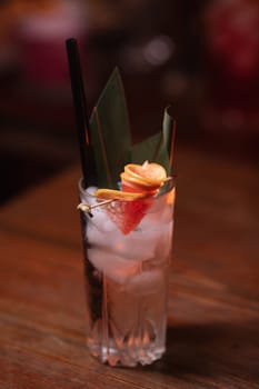 Beautiful photo of cocktail food. A bright juicy cocktail is on the table in the restaurant. Professional food photography.