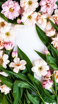 Frame surrounded by spring flowers. High quality photo