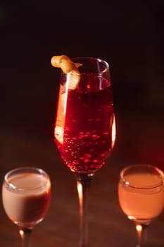 A beautiful bright cocktail. Restaurant, a glass with a drink is on the table.