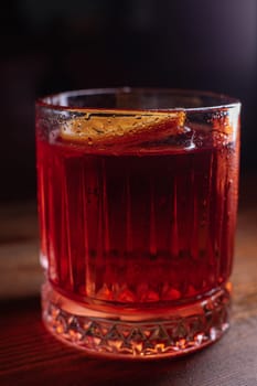 A beautiful bright cocktail. Restaurant, a glass with a drink is on the table.