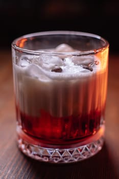 A beautiful bright cocktail. Restaurant, a glass with a drink is on the table.