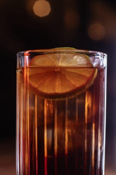 A beautiful bright cocktail. Restaurant, a glass with a drink is on the table.