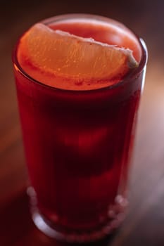 A beautiful bright cocktail. Restaurant, a glass with a drink is on the table.