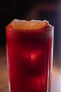 A beautiful bright cocktail. Restaurant, a glass with a drink is on the table.
