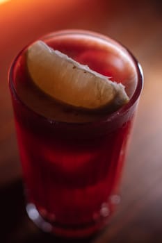 A beautiful bright cocktail. Restaurant, a glass with a drink is on the table.