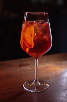A beautiful bright cocktail. Restaurant, a glass with a drink is on the table.