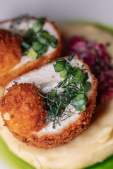 Delicious cutlets with airy mashed potatoes served in the restaurant. The perfect photo for a menu, culinary blog, or an advertisement for catering establishments