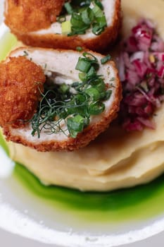 Delicious cutlets with airy mashed potatoes served in the restaurant. The perfect photo for a menu, culinary blog, or an advertisement for catering establishments