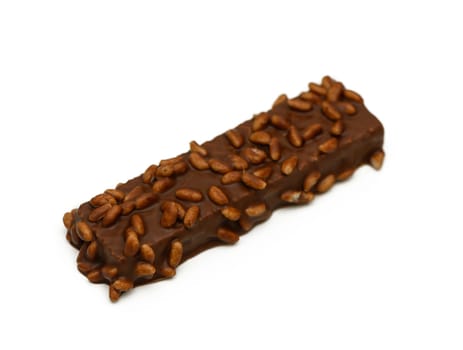 A delicious chocolate bar adorned with crispy seeds offers a tempting treat for sweet lovers and snack enthusiasts.