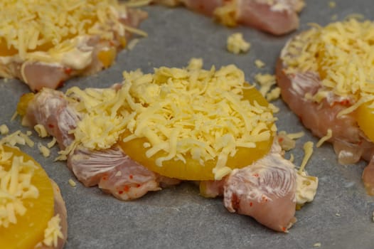 Tender chicken pieces layered with sweet pineapple and melted cheese, prepared for a delightful oven bake.