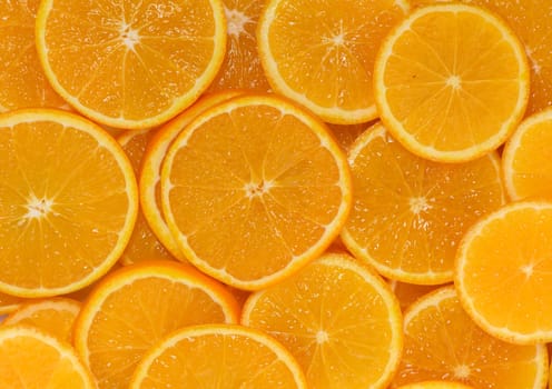 Vibrant orange slices layered together showcase their juicy texture and rich color, inviting fresh flavor and health.