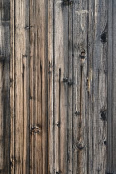 Beautifully textured wooden planks create an artistic contrast of colors and patterns in open daylight.