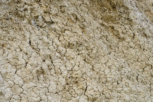 Cracked soil shows the effects of drought, portraying a stark and beautiful texture of nature’s resilience.