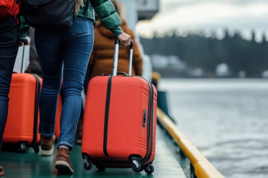 A woman walks with an orange suitcase towards a ferry, ready for an exciting travel adventure across the water. The scene captures a cool day filled with anticipation.
