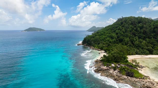 Sandy shores on tropical islands and clear turquoise seas. Seychelles, Mahe.