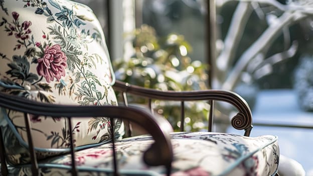 Colorful pillows on sofa against glass wall of window in a winter garden or conservatory. Interior textile concept. High quality photo