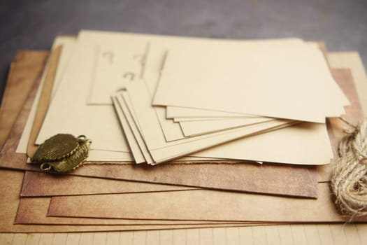 Vintage paper sheets and stationery arranged on a wooden table