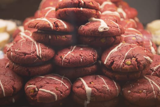 Delicious red velvet cookies are neatly arranged in a display.