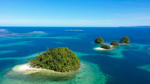 Aerial drone of Seascape with beautiful beach. Britania Islands, Surigao del Sur, Philippines.