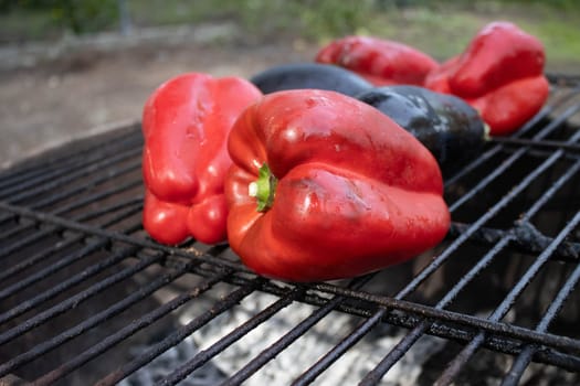 Roasted red pepper and eggplant to make the typical Catalan dish Escalivada cooked on the barbecue