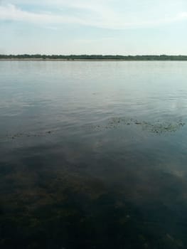 the tranquility of a quiet river, where the gentle flow invites one to rest and reflect on a clear summer day.