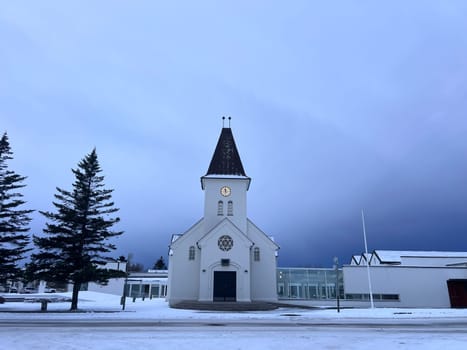 small church in the snow in Keflavik, Iceland. High quality photo
