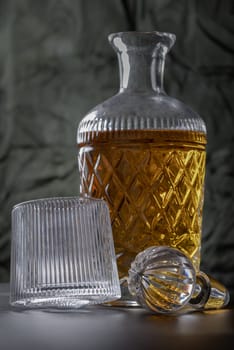 Design elements of The crystal decanter of whiskey, Glass Lid with Whiskey glass with reflection. use it as your Wallpaper, Poster and Space for text, Selective focus.