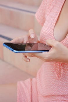 Woman hands typing on phone browsing social media