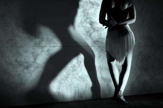 Woman with green dress dancing latin dance 