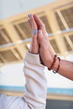 Two friends holding hands. An image of bonding, friendship and trust in friendship. Image of two friends supporting each other.