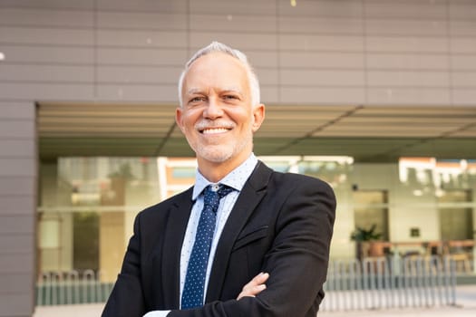 Professional, mature and smiling executive manager, proud lawyer, business leader in suit and tie looking at camera.