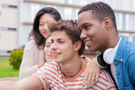group of friends taking a selfie together and laughing together at the university.Technology or networking, connectivity and happy college people take a photo smiling for social media