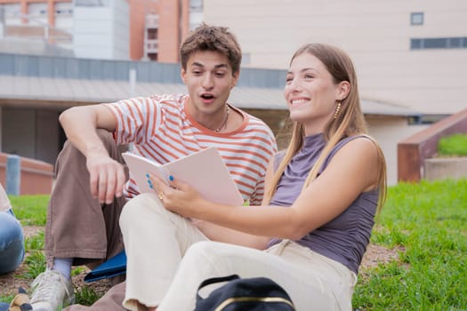 Happy caucasian college friends outdoors preparing for exam.