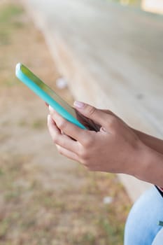 Woman hands typing on phone browsing mobile phone on social media