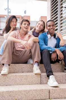 multiracial students gathering on campus. concepts of youth, university life, adolescent and urban life