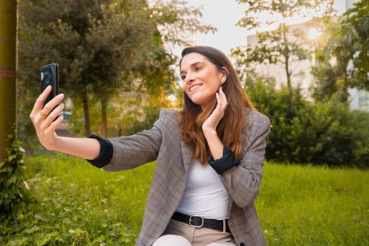 Happy female making a video call with a smartphone.