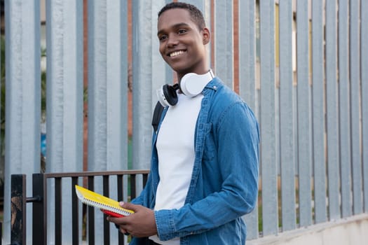 Young black man standing on university campus.College life concept