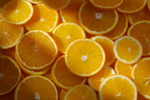 Juicy orange slices are arranged beautifully, showcasing their bright color and freshness, perfect for a summer dish.