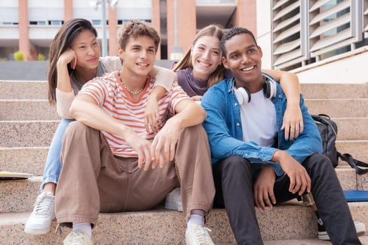 multiracial students gathering on campus. concepts of youth, university life, adolescent and urban life