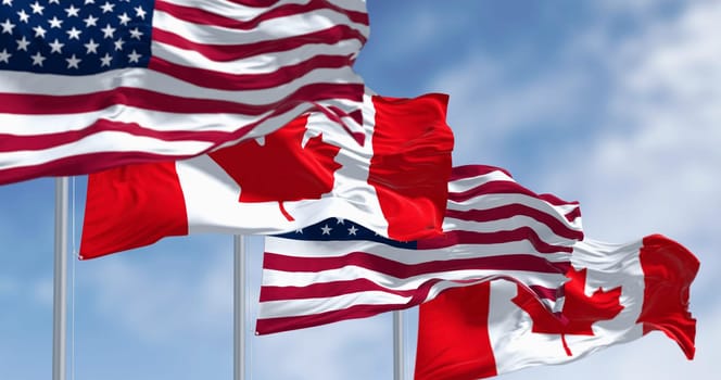 Canada and american national flags waving in the wind on a clear day. North America Countries. 3D illustration render. Rippled fabric. Selective focus Rippled fabric. Selective focus