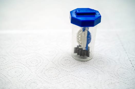close-up of a container for cleaning and storing contact lenses for eyes, used at home. For soft and hard lenses.