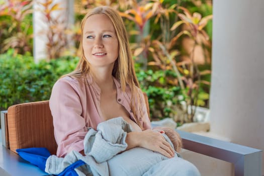 A mother breastfeeds her baby in a cozy cafe, embracing a natural and nurturing moment amidst a casual, public setting. This intimate scene reflects modern parenting, maternal love, and the beauty of everyday life.