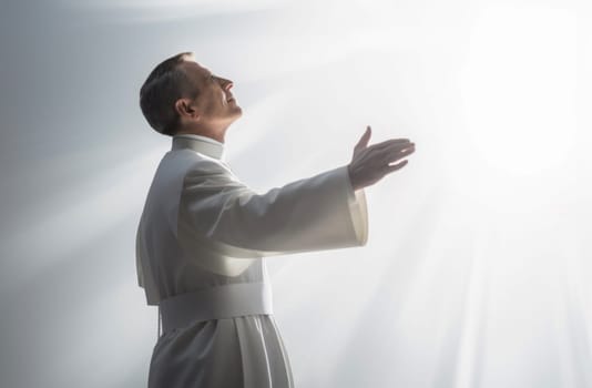Priest raising his hands at the 'Our Father'. Catholic Liturgy. Celebrating Holy Communion. Eucharistic Prayer. Homily. Prayers of the Faithful. Final Blessing