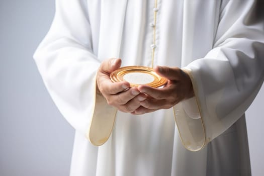Sacred bread. Eucharistic body of Christ. Priest holding the hostia. Offertory, Eucharistic Prayer, Consecration, Lord’s Prayer. Daily bread. The Most Holy Body and Blood of Christ