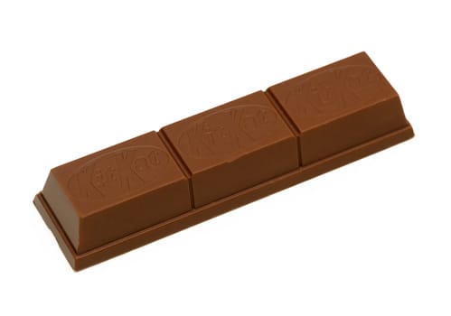 Gaziveren Cyprus -10.02.2025 Three-piece chocolate bar glistens invitingly, evoking cravings for a sweet moment of indulgence.