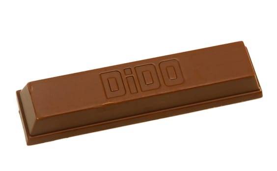 Gaziveren Cyprus -10.02.2025 A chocolate bar with a sleek, modern design rests on a plain surface, showcasing its glossy finish and branding.
