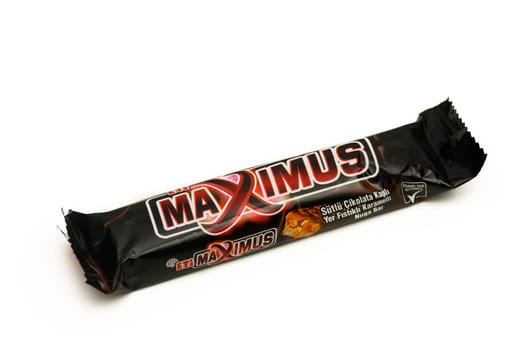 Gaziveren Cyprus -10.02.2025 A tempting chocolate bar wrapped in striking black packaging, featuring enticing branding and playful design elements.