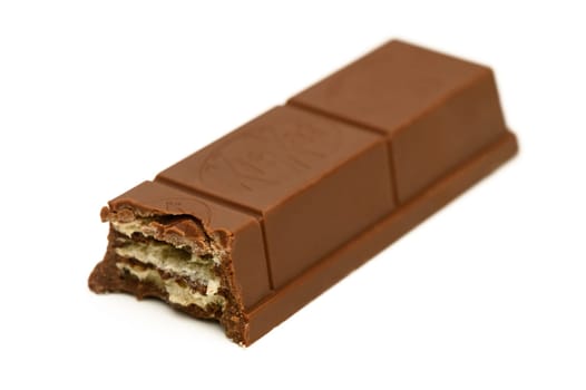 Gaziveren Cyprus -10.02.2025 A rich, creamy chocolate bar showcases layers of crispy wafers, inviting a sweet, satisfying crunch with every bite.